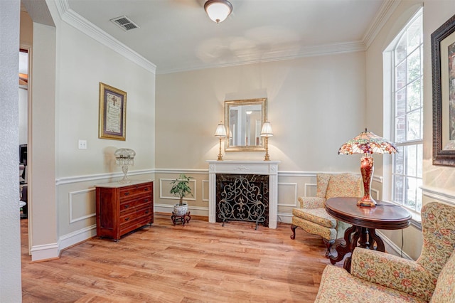 12332 Green Ash Dr, Fort Worth, TX 76244 - living area with ornamental molding, wood finished floors, a wainscoted wall, and a high end fireplace