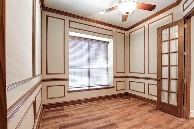 12332 Green Ash Dr, Fort Worth, TX 76244 - empty room featuring a decorative wall, crown molding, light wood-style flooring, and a ceiling fan