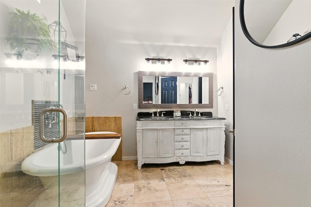 3320 S Fm 548, Royse City, TX 75189 - full bath with double vanity, a soaking tub, a shower stall, and baseboards