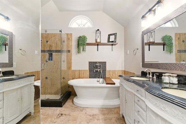 3320 S Fm 548, Royse City, TX 75189 - full bathroom featuring a shower stall, a freestanding bath, double vanity, vaulted ceiling, and wainscoting
