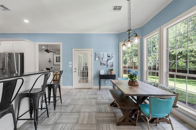 306 Winding Creek Ln, Mcgregor, TX 76657 - dining area with baseboards, crown molding, ceiling fan, and recessed lighting