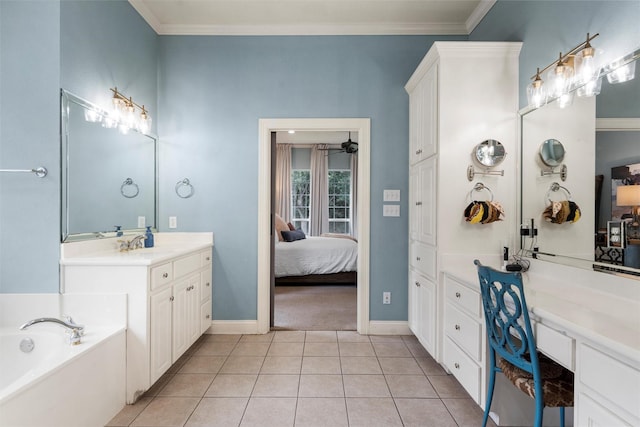 306 Winding Creek Ln, Mcgregor, TX 76657 - ensuite bathroom featuring a garden tub, tile patterned floors, crown molding, vanity, and baseboards