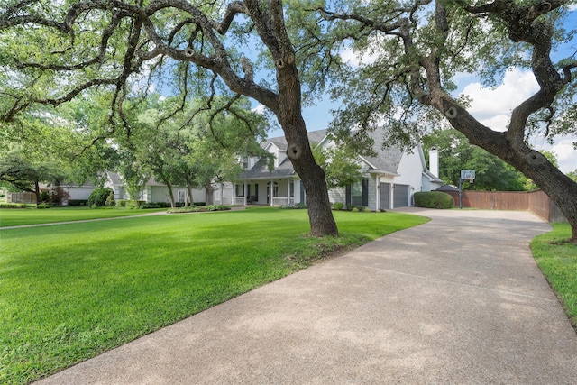 306 Winding Creek Ln, Mcgregor, TX 76657 - obstructed view of property with concrete driveway and a garage