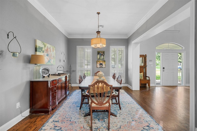 306 Winding Creek Ln, Mcgregor, TX 76657 - dining space featuring dark wood finished floors, baseboards, and ornamental molding