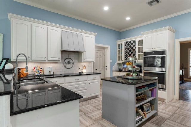 306 Winding Creek Ln, Mcgregor, TX 76657 - kitchen featuring stainless steel double oven, a sink, open shelves, tasteful backsplash, and white cabinets