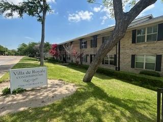 7704 Royal Ln Unit D, Dallas, TX 75230 - view of home's community featuring a lawn