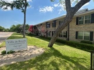 7704 Royal Ln Unit D, Dallas, TX 75230 - view of home's community featuring a lawn