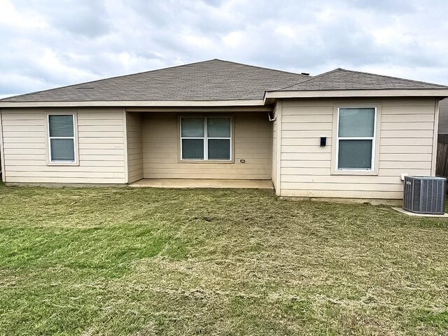 10028 Quail Glen Dr, Fort Worth, TX 76140 - rear view of house with central air condition unit, a lawn, and a patio