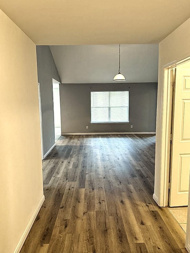 10028 Quail Glen Dr, Fort Worth, TX 76140 - unfurnished room featuring dark wood-style flooring, baseboards, and vaulted ceiling