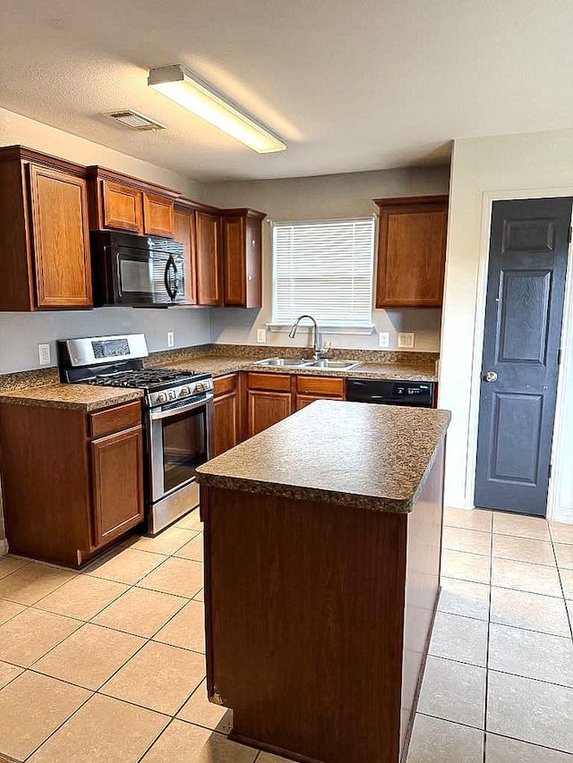 10028 Quail Glen Dr, Fort Worth, TX 76140 - kitchen featuring black appliances, a sink, light tile patterned flooring, and dark countertops