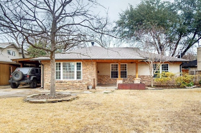 6723 Blessing Dr, Dallas, TX 75214 - view of front of home with stone siding and a front lawn