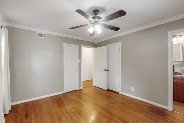 6723 Blessing Dr, Dallas, TX 75214 - unfurnished bedroom featuring light wood-style flooring, ornamental molding, baseboards, connected bathroom, and ceiling fan