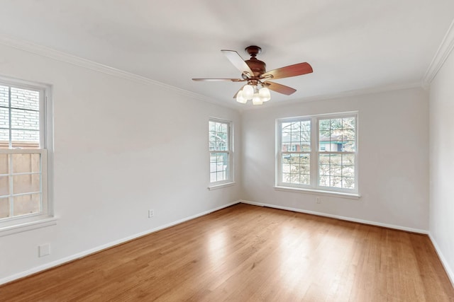 6723 Blessing Dr, Dallas, TX 75214 - spare room featuring wood finished floors, baseboards, crown molding, and a ceiling fan
