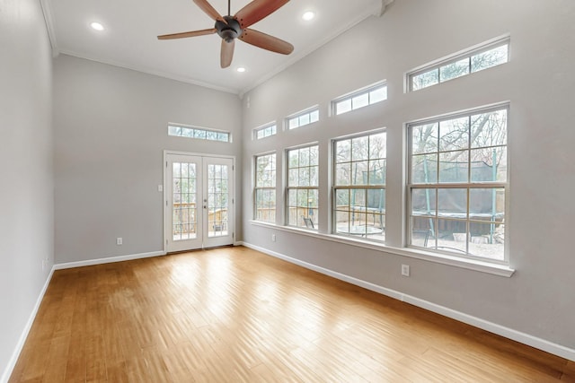 6723 Blessing Dr, Dallas, TX 75214 - spare room featuring plenty of natural light, baseboards, crown molding, wood finished floors, and recessed lighting