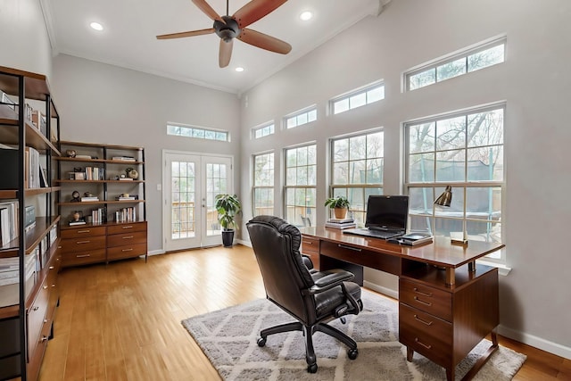 6723 Blessing Dr, Dallas, TX 75214 - office featuring french doors, light wood-style floors, baseboards, a high ceiling, and ornamental molding