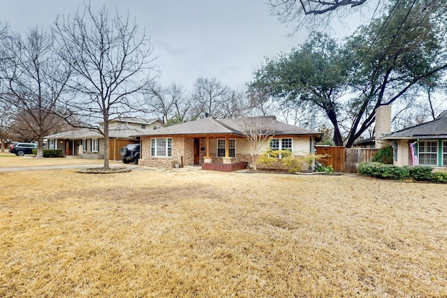 6723 Blessing Dr, Dallas, TX 75214 - ranch-style house featuring an attached carport, brick siding, and driveway