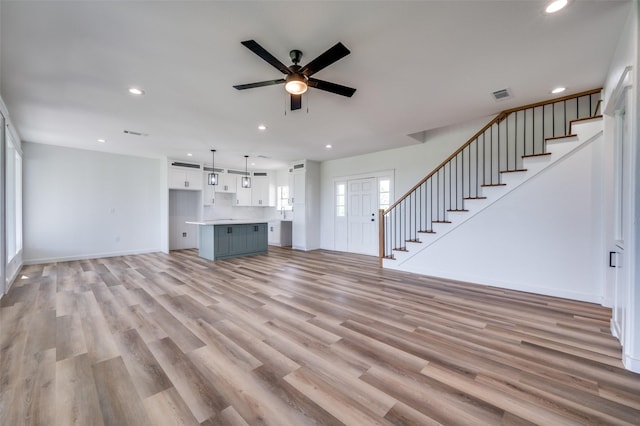 488 Klas Rd, Sherman, TX 75092 - unfurnished living room featuring ceiling fan, stairway, recessed lighting, and light wood finished floors