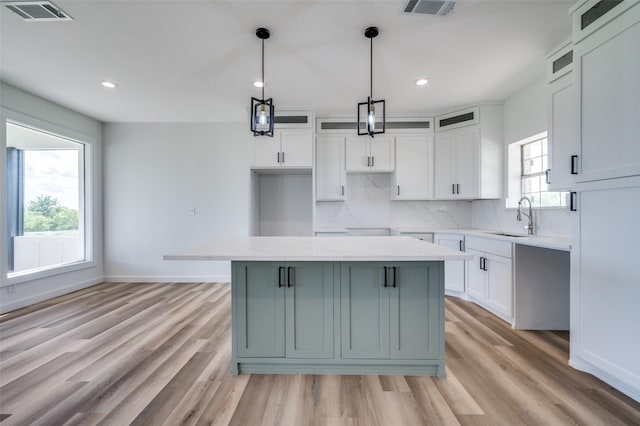 488 Klas Rd, Sherman, TX 75092 - kitchen with backsplash, white cabinets, light wood-type flooring, glass insert cabinets, and recessed lighting