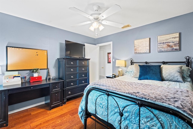 bedroom with light wood finished floors and ceiling fan