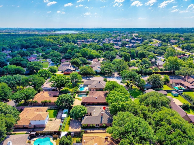 aerial perspective of suburban area featuring a pool