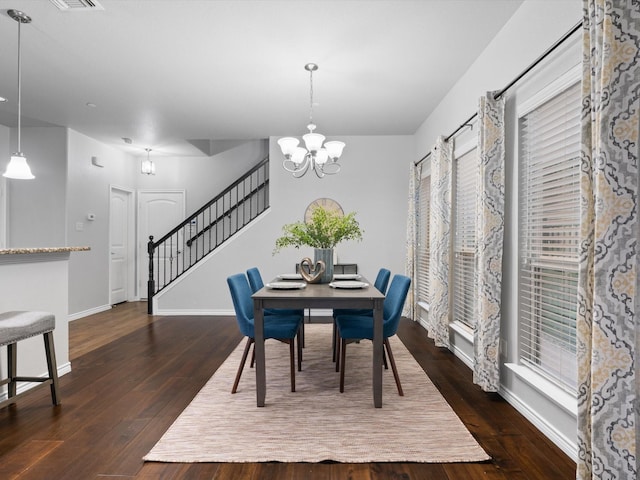 8821 Whitehead St, Mckinney, TX 75070 - dining room with stairs, baseboards, dark wood finished floors, and a chandelier