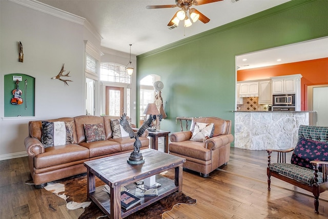 122 King Ranch Ct, Fort Worth, TX 76108 - living room with ceiling fan, light wood-style floors, crown molding, and baseboards