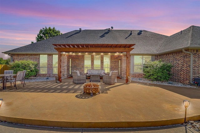 122 King Ranch Ct, Fort Worth, TX 76108 - patio terrace at dusk featuring a pergola and an outdoor living space with a fire pit