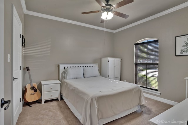 bedroom with light colored carpet, crown molding, baseboards, and a ceiling fan