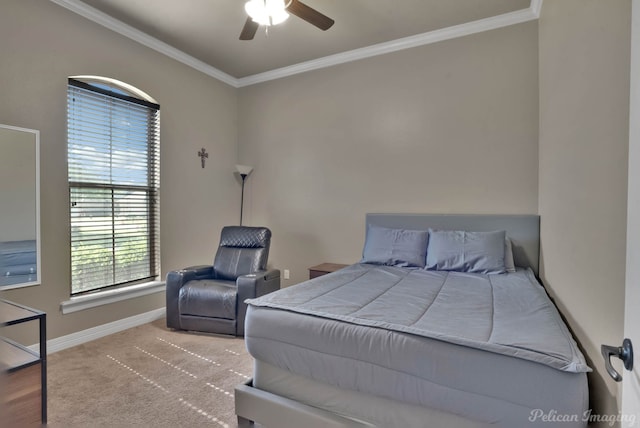 bedroom featuring ornamental molding, baseboards, and a ceiling fan