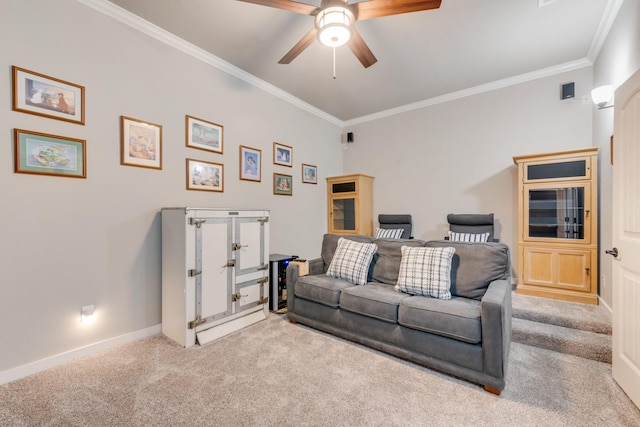 carpeted living room featuring ceiling fan, ornamental molding, and baseboards