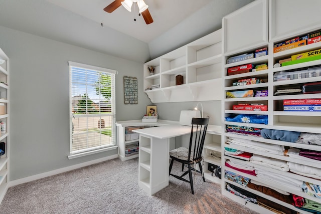 carpeted home office featuring a ceiling fan and baseboards