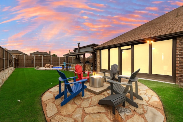 patio terrace at dusk with an outdoor fire pit
