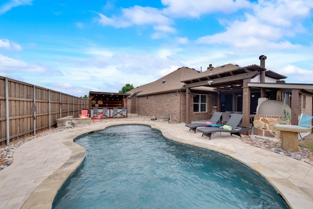 view of swimming pool featuring a fenced backyard, a patio, and a pergola