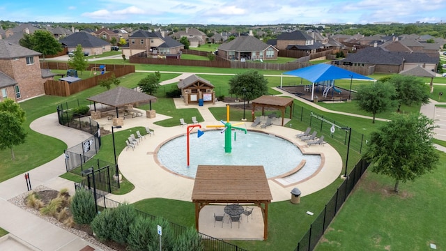 view of swimming pool with a gazebo and a residential view