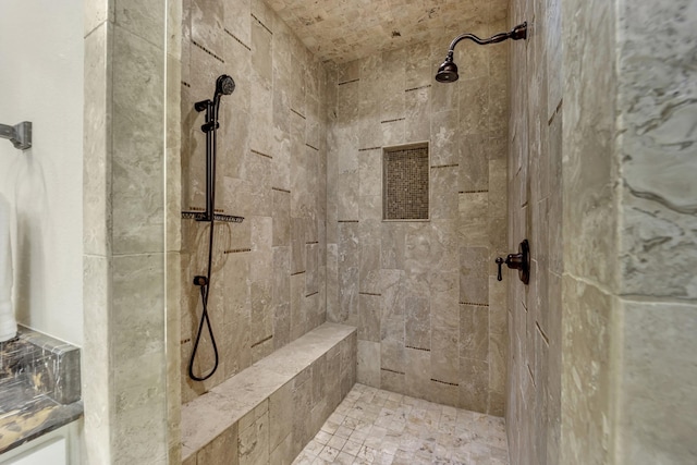 full bath featuring a tile shower