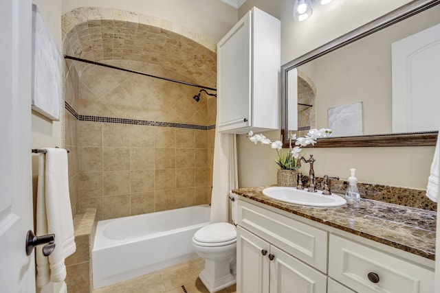 bathroom featuring shower / bath combination, toilet, vanity, and tile patterned floors