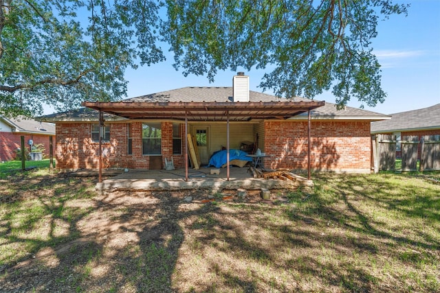 4627 Lexington St, Bellmead, TX 76705 - rear view of property with brick siding, a patio, and a chimney