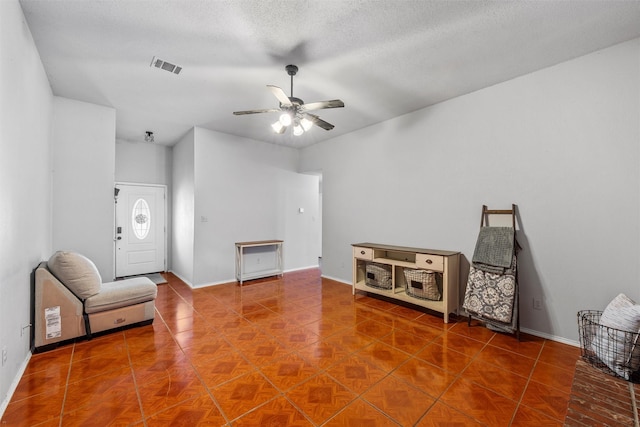 4627 Lexington St, Bellmead, TX 76705 - entryway featuring ceiling fan, baseboards, and a textured ceiling