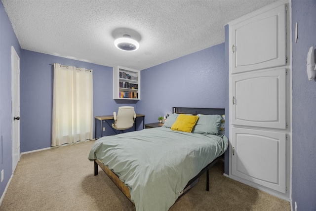 carpeted bedroom with a textured ceiling