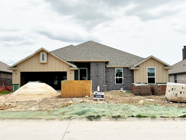 697 Fossil Wood Dr, Saginaw, TX 76179 - view of front of property featuring a shingled roof, a garage, and board and batten siding