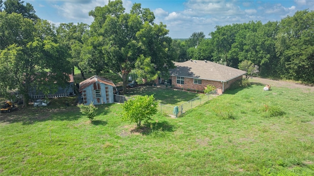 12097 Kyle Ln, Blue Ridge, TX 75424 - view of yard with a storage unit and an outbuilding