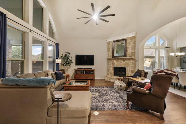 4213 Autumn Path Rd, Denton, TX 76208 - living room with high vaulted ceiling, a chandelier, ceiling fan, a fireplace, and wood finished floors