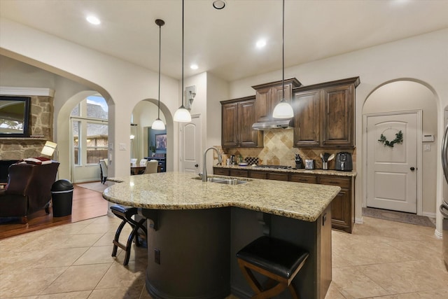 4213 Autumn Path Rd, Denton, TX 76208 - kitchen with a sink, arched walkways, backsplash, light tile patterned floors, and recessed lighting