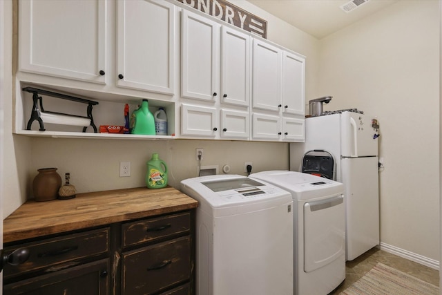 4213 Autumn Path Rd, Denton, TX 76208 - washroom with cabinet space, independent washer and dryer, baseboards, and light tile patterned floors