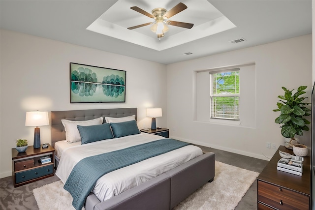 2024 Kraft St, Dallas, TX 75212 - carpeted bedroom featuring a raised ceiling, baseboards, and a ceiling fan