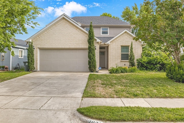 2024 Kraft St, Dallas, TX 75212 - view of front of house featuring driveway, an attached garage, a front lawn, and brick siding