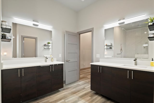 1595 Bledsoe Rd, Gunter, TX 75058 - full bathroom with two vanities and wood finished floors