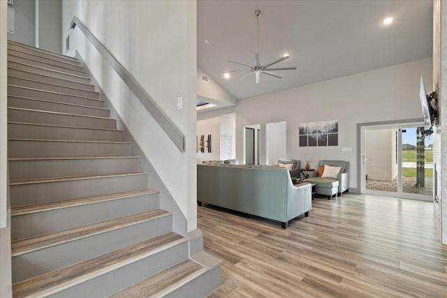 1595 Bledsoe Rd, Gunter, TX 75058 - stairs featuring high vaulted ceiling, ceiling fan, wood finished floors, and recessed lighting