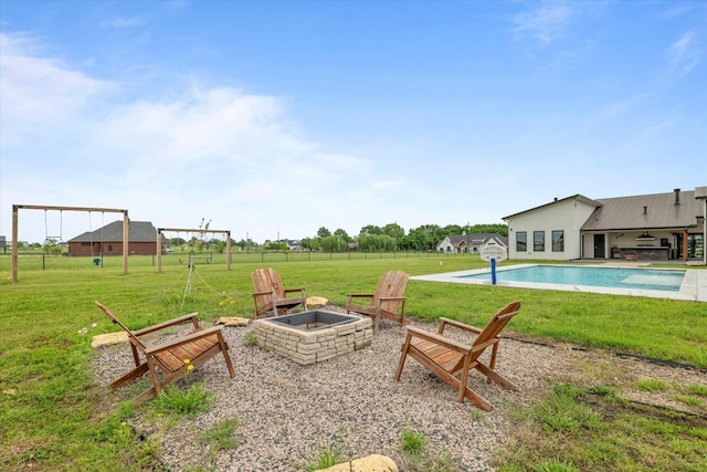 1595 Bledsoe Rd, Gunter, TX 75058 - view of grassy yard featuring a fire pit, an outdoor pool, and a patio