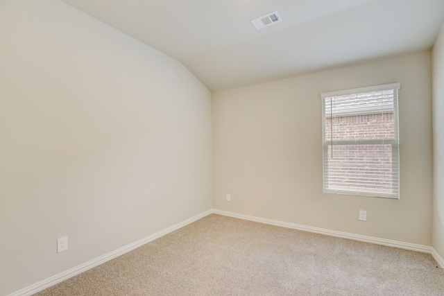 506 Stagg St, Mckinney, TX 75069 - spare room with light carpet, baseboards, and vaulted ceiling